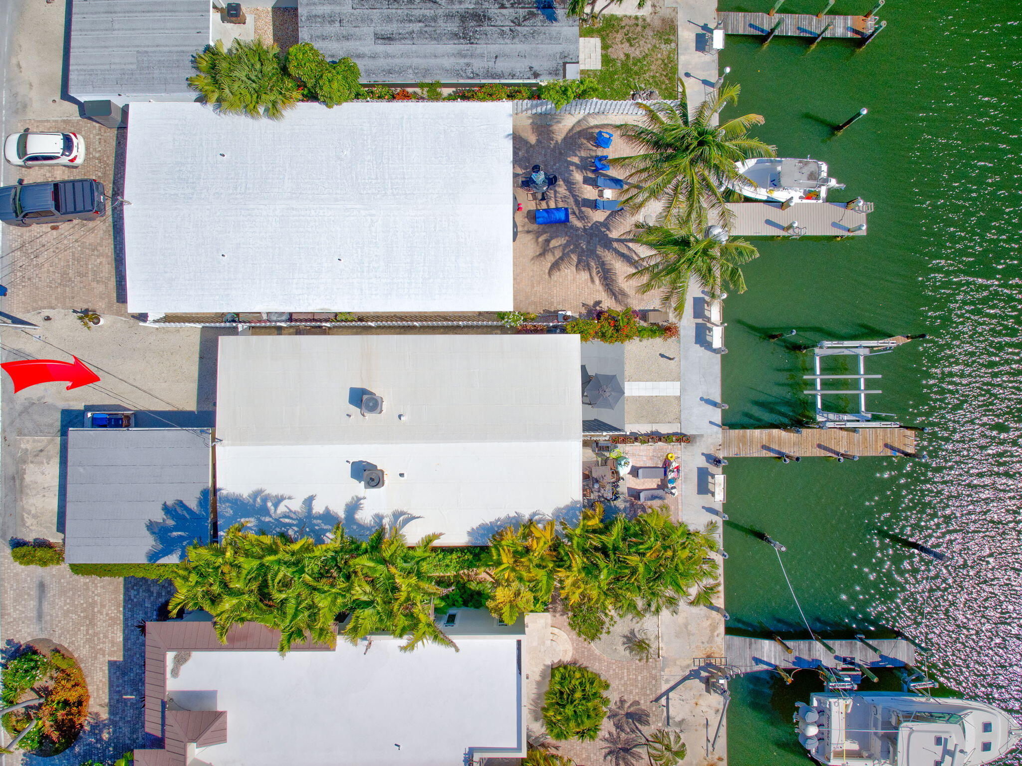 4 7th Street Key Colony Beach, FL 33051 - Photo 27 of 44 an aerial view of a house with a garden and trees