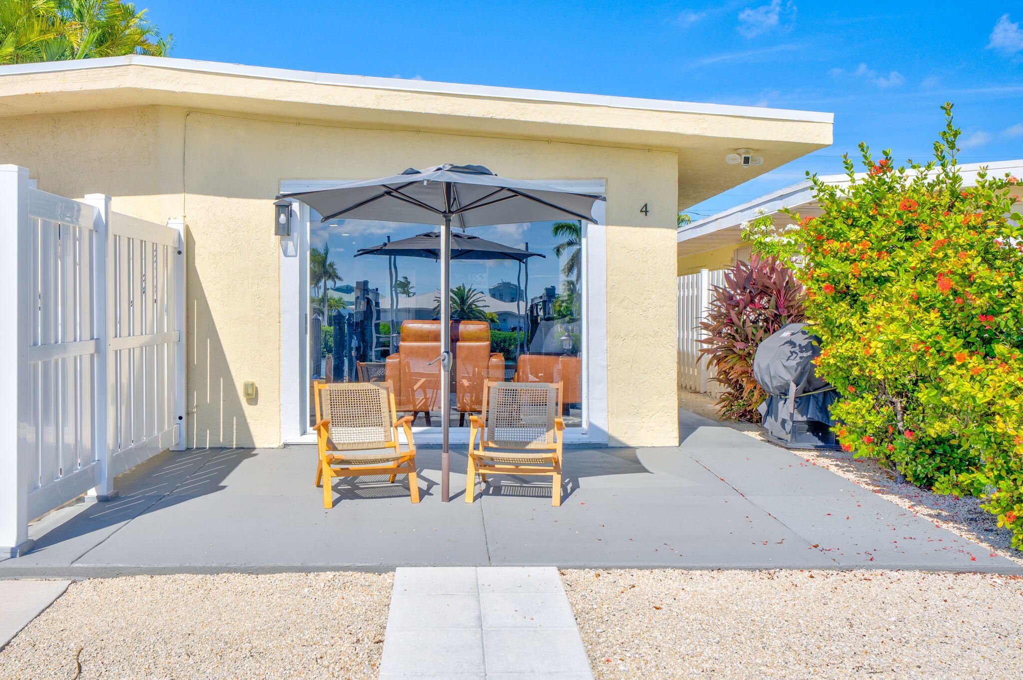 4 7th Street Key Colony Beach, FL 33051 - Photo 42 of 44 a view of a patio with table and chairs potted plants