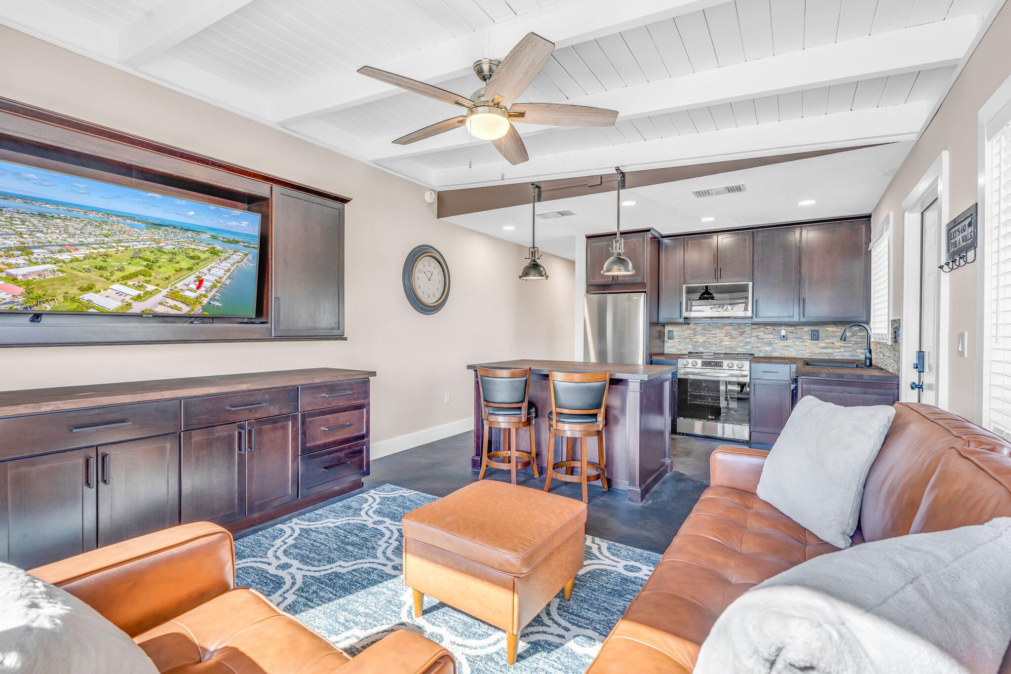 4 7th Street Key Colony Beach, FL 33051 - Photo 6 of 44 a living room with furniture kitchen view and a flat screen tv