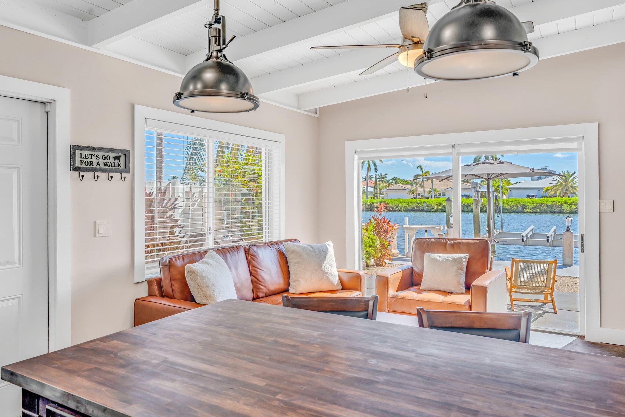 4 7th Street Key Colony Beach, FL 33051 - Photo 10 of 44 a bedroom with a bed and a chandelier