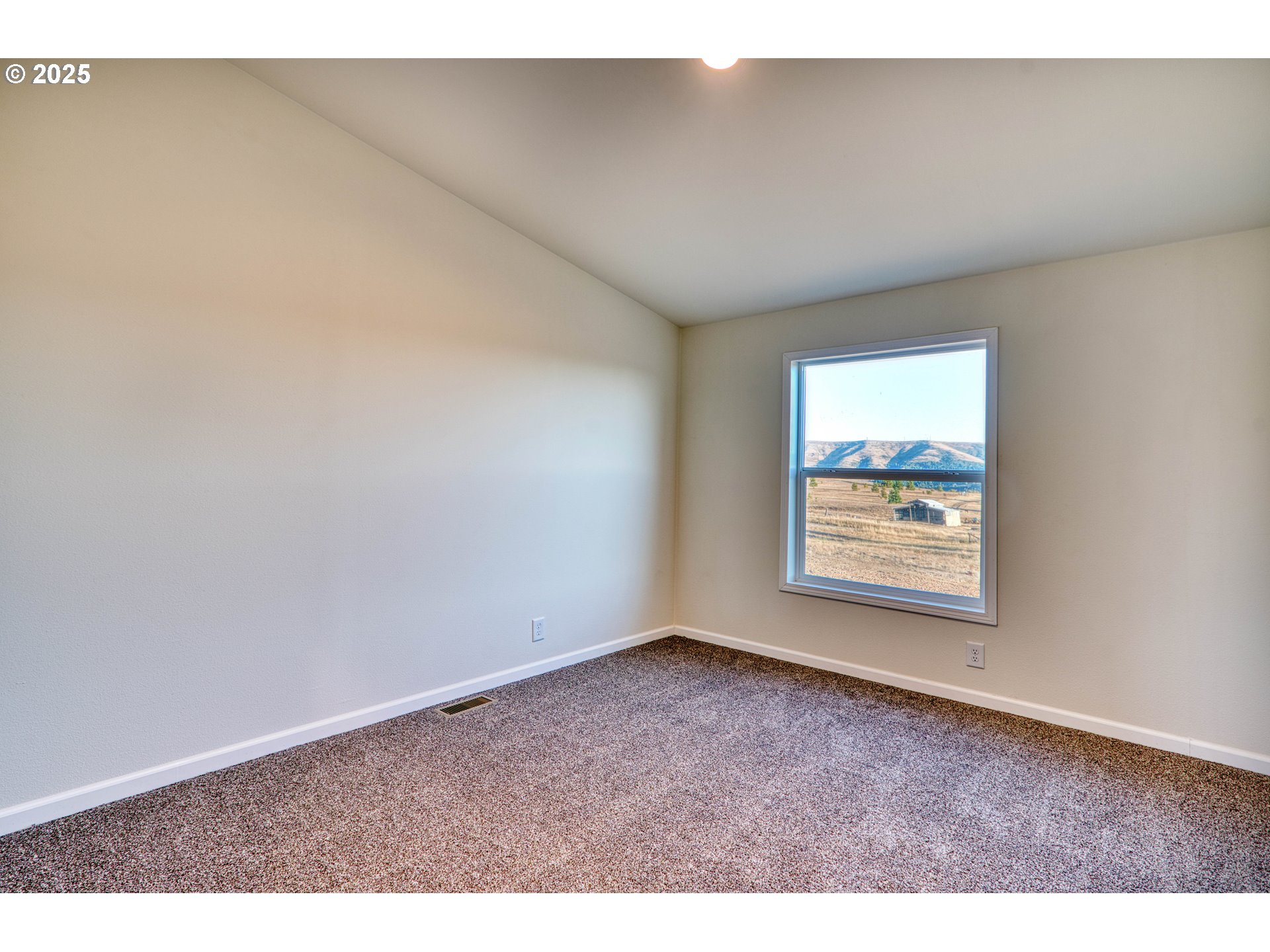 955 High Prairie Road Lyle, WA 98635 - Photo 15 of 35 an empty room with windows