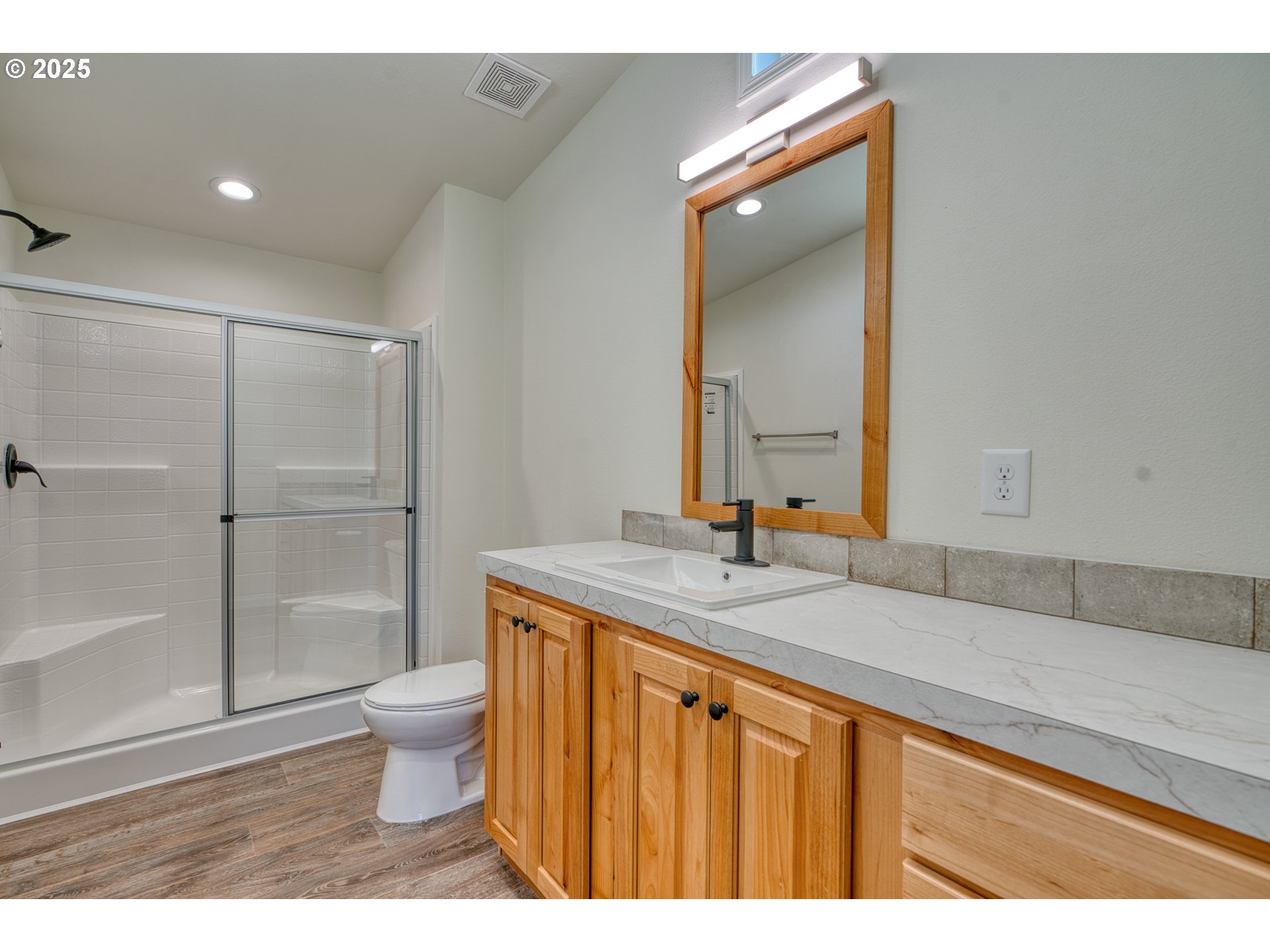 955 High Prairie Road Lyle, WA 98635 - Photo 22 of 35 a bathroom with a granite countertop sink a toilet and a mirror
