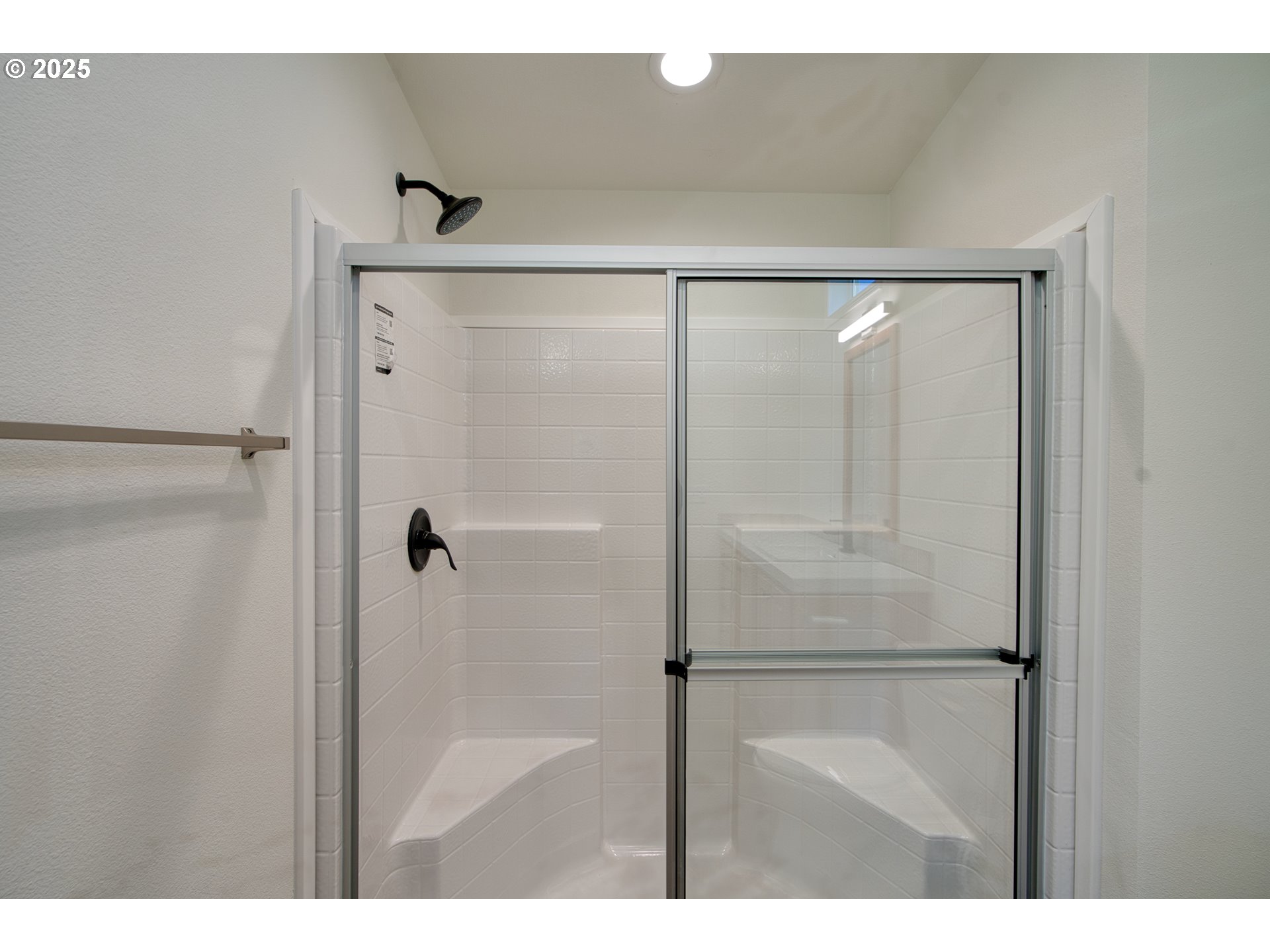 955 High Prairie Road Lyle, WA 98635 - Photo 23 of 35 a bathroom with a glass shower door