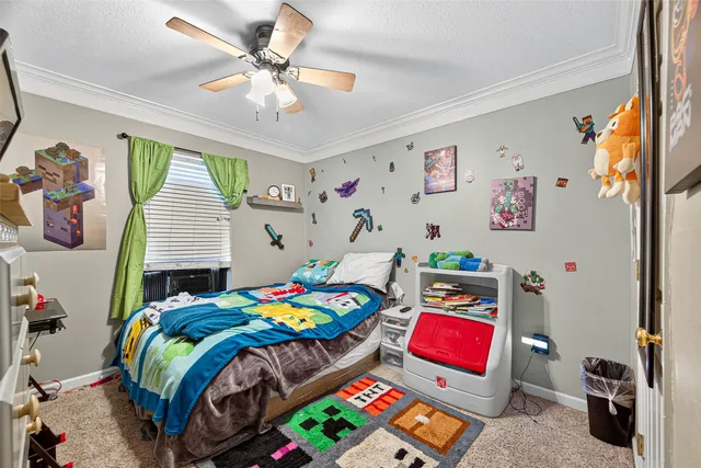 a bedroom with a bed and a tv in it