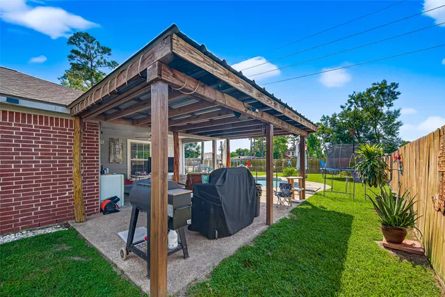 a view of a backyard with swimming pool