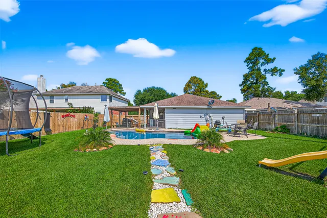 a view of a yard with a slide