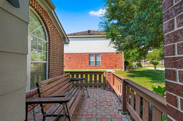 a view of a chairs and table in the balcony