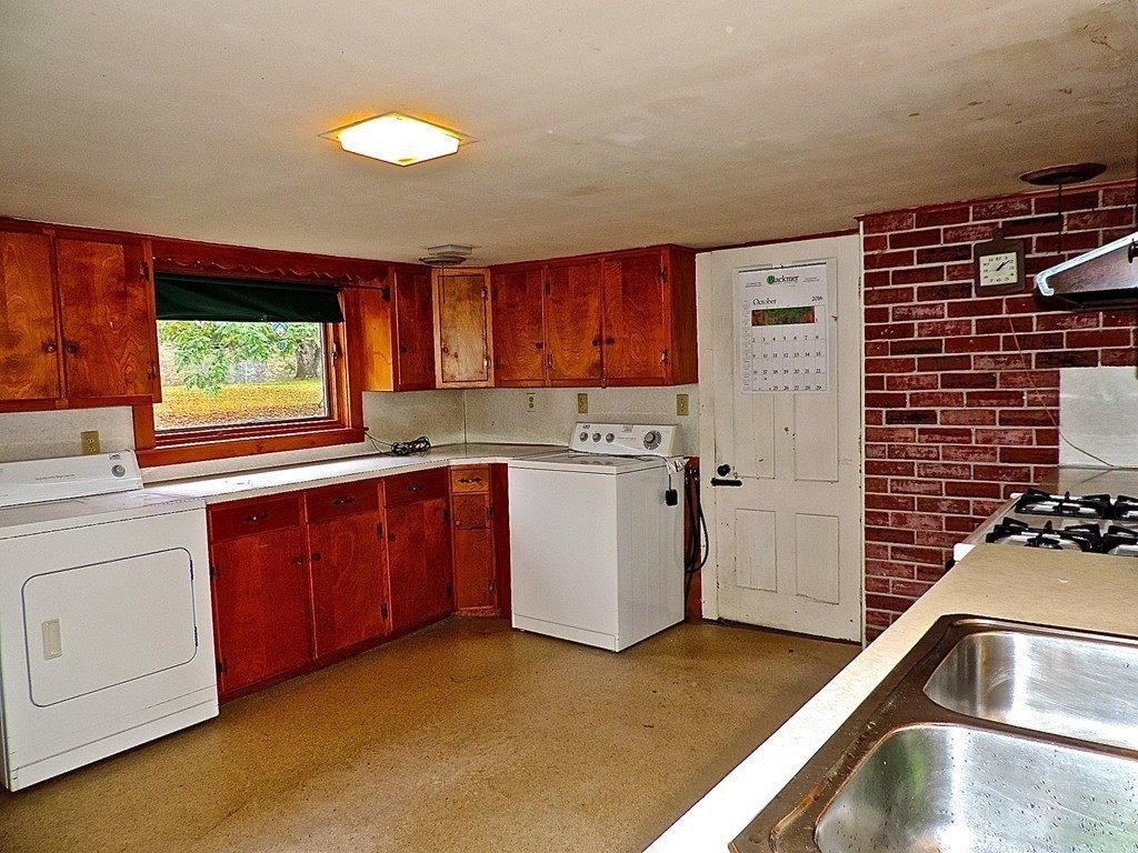 50 Creamery Road Ashfield, MA 01330 - Photo 6 of 24 a kitchen with a stove a sink and a cabinets