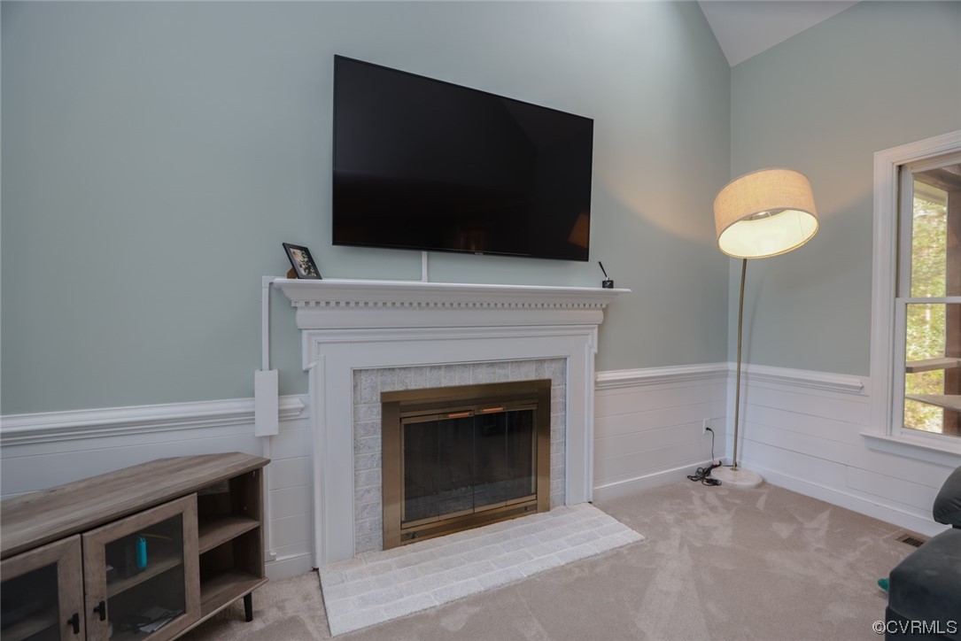 10324 Berkeley Manor Drive Ashland, VA 23005 - Photo 21 of 39 a living room with a fireplace and a flat screen tv