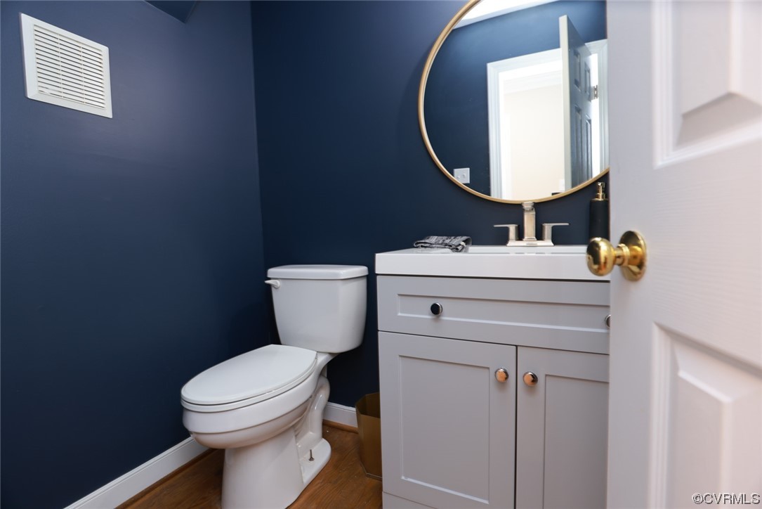 10324 Berkeley Manor Drive Ashland, VA 23005 - Photo 22 of 39 a bathroom with a sink mirror vanity and toilet