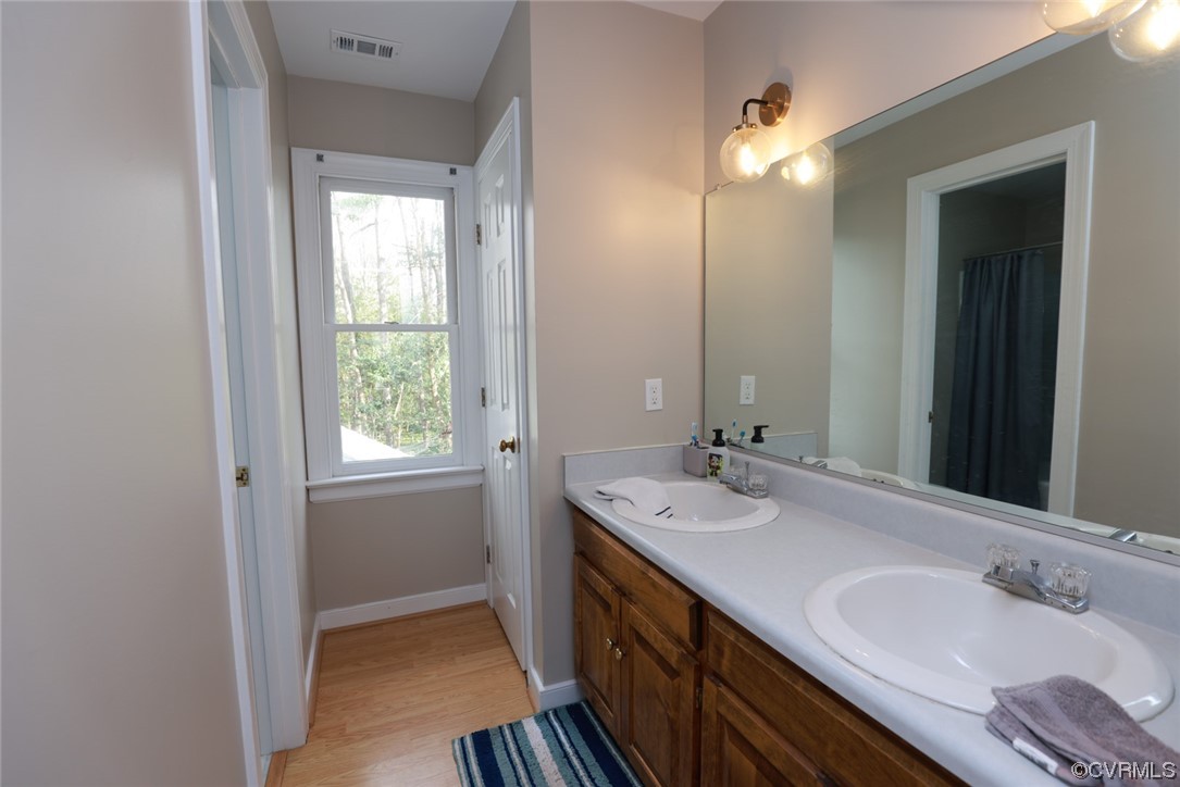 10324 Berkeley Manor Drive Ashland, VA 23005 - Photo 25 of 39 a bathroom with a double vanity sink and a mirror