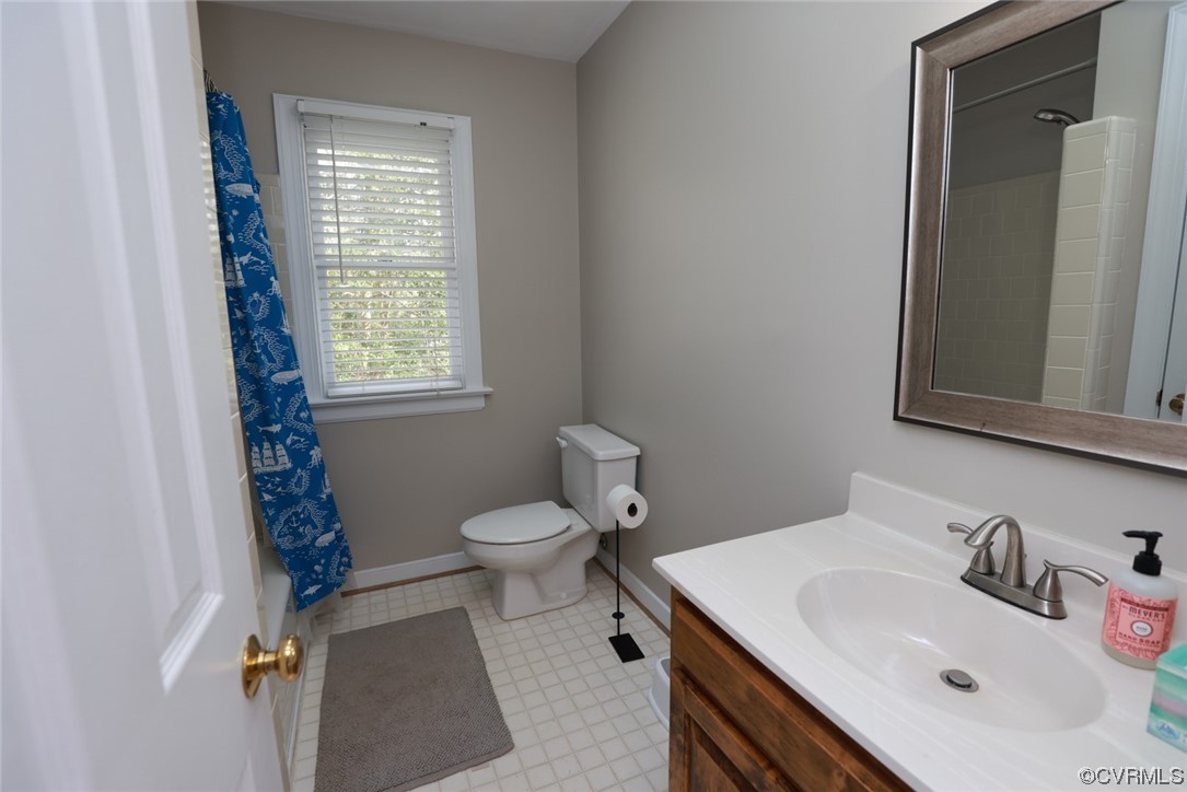 10324 Berkeley Manor Drive Ashland, VA 23005 - Photo 29 of 39 a bathroom with a sink toilet and window