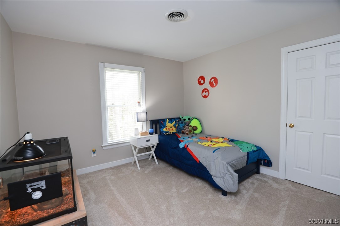 10324 Berkeley Manor Drive Ashland, VA 23005 - Photo 30 of 39 a bedroom with a bed and a window