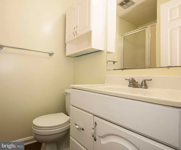 a bathroom with a sink toilet and vanity