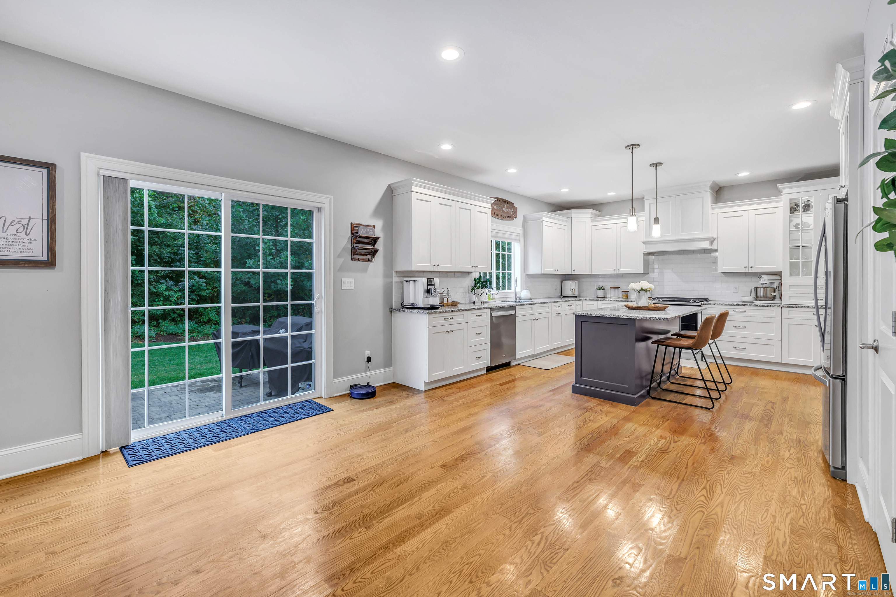 7 Winthrop Woods Road Shelton, CT 06484 - Photo 14 of 21 a view of a kitchen with stainless steel appliances wooden cabinets and dining table