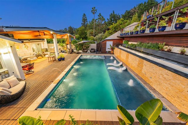 a view of swimming pool with a patio