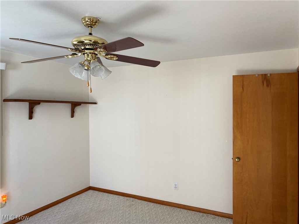 421 Omar Street Struthers, OH 44471 - Photo 10 of 31 Spare room featuring ceiling fan and light colored carpet