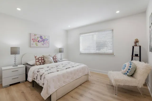 a bedroom with a bed and a couch