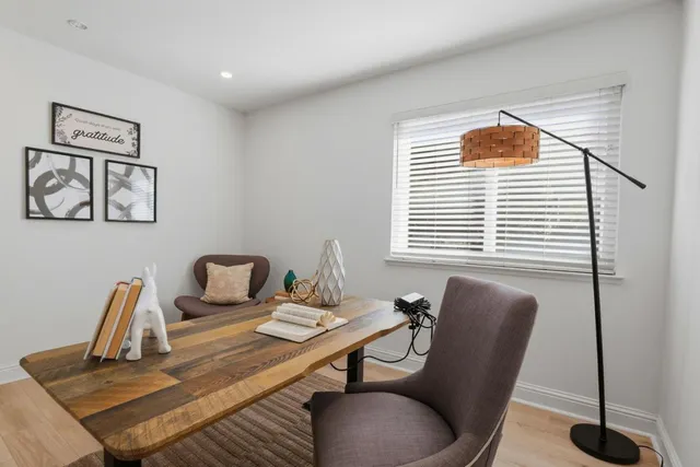 a view of a dining room with furniture window and wooden floor