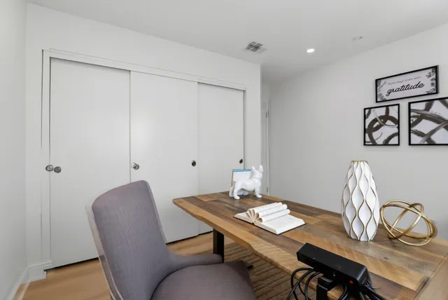 a view of a workspace with furniture