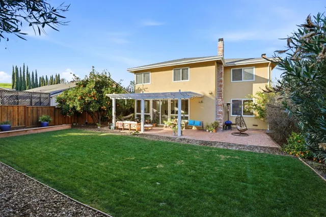 a front view of house with yard and outdoor seating