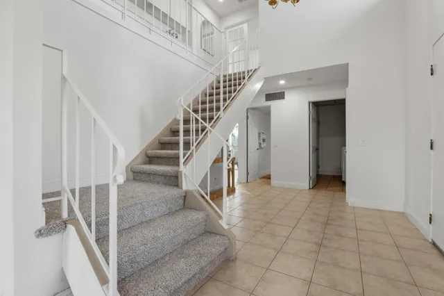a view of entryway and hall with a living room