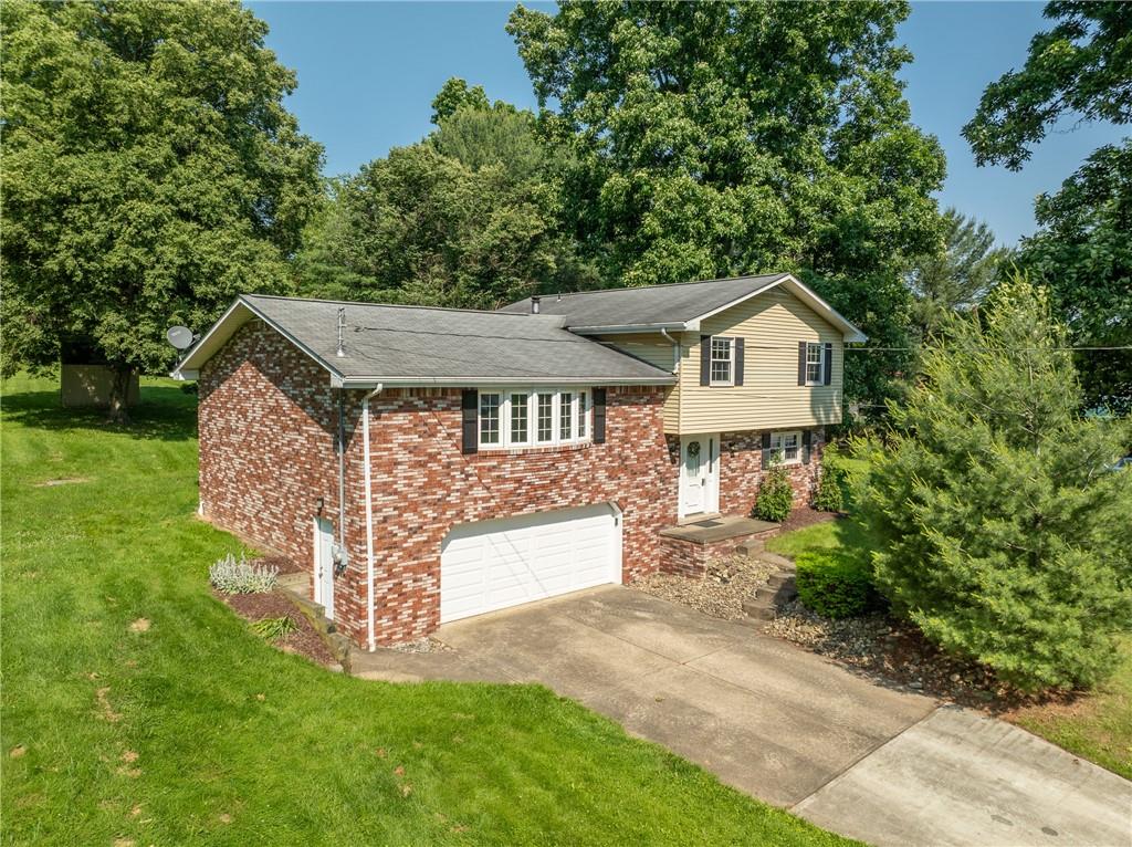 756 Arona Road New Stanton, PA 15672 - Photo 1 of 35 a front view of a house with a yard