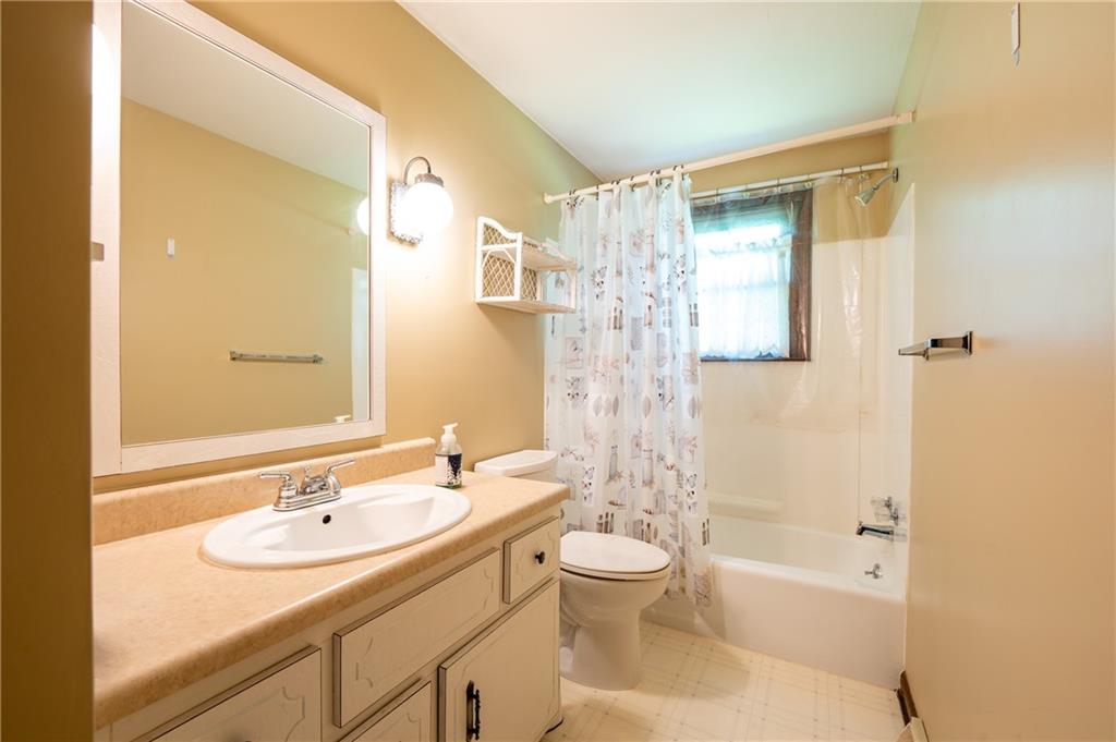 756 Arona Road New Stanton, PA 15672 - Photo 13 of 35 a bathroom with a sink a toilet and shower