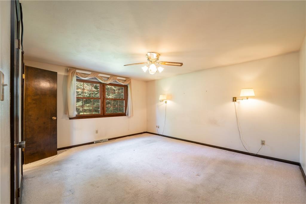 756 Arona Road New Stanton, PA 15672 - Photo 16 of 35 an empty room with fan and windows