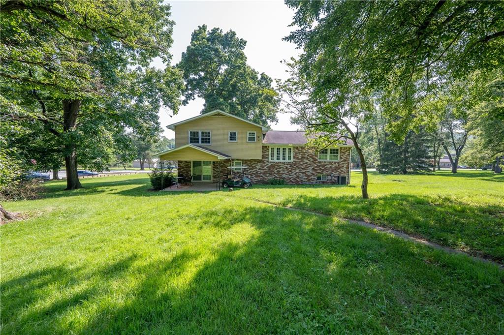 756 Arona Road New Stanton, PA 15672 - Photo 27 of 35 a front view of a house with a yard and trees