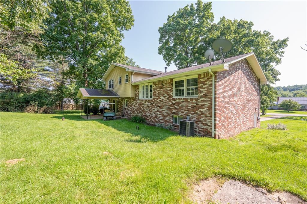 756 Arona Road New Stanton, PA 15672 - Photo 28 of 35 a view of a house with a yard and sitting area