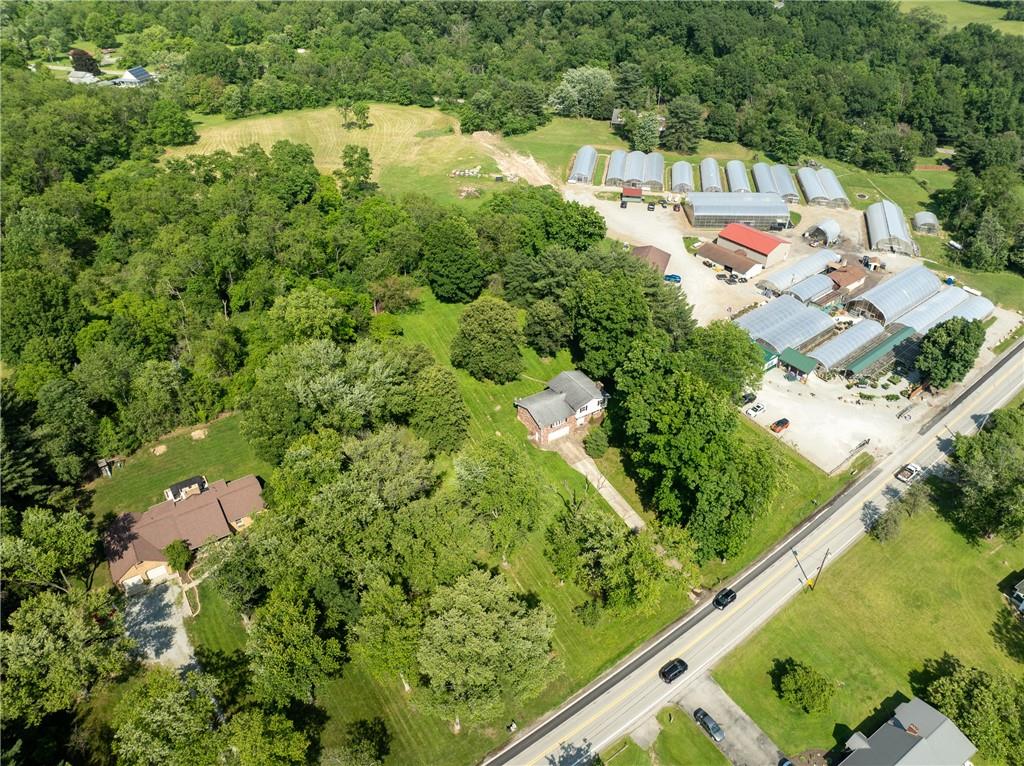 756 Arona Road New Stanton, PA 15672 - Photo 35 of 35 an aerial view of a house with a yard and lake view