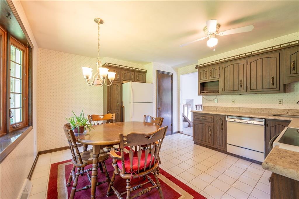 756 Arona Road New Stanton, PA 15672 - Photo 7 of 35 a view of a dining room with furniture window and wooden floor