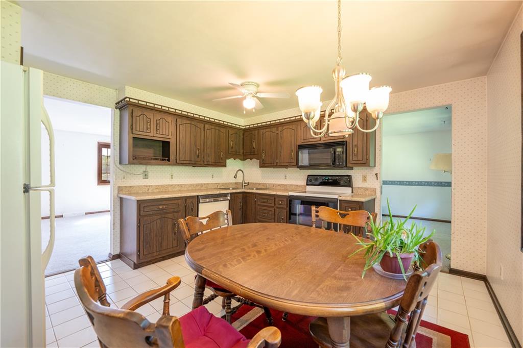 756 Arona Road New Stanton, PA 15672 - Photo 8 of 35 a dining room with furniture a window and kitchen view