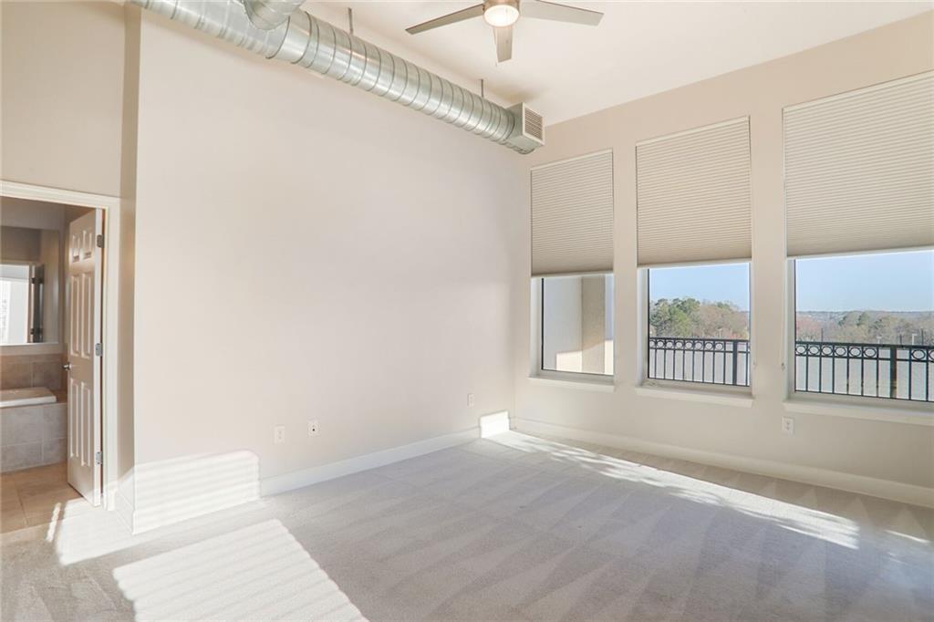3820 Roswell Road Northeast, Unit 317 Atlanta, GA 30342 - Photo 18 of 29 a view of an empty room and a window