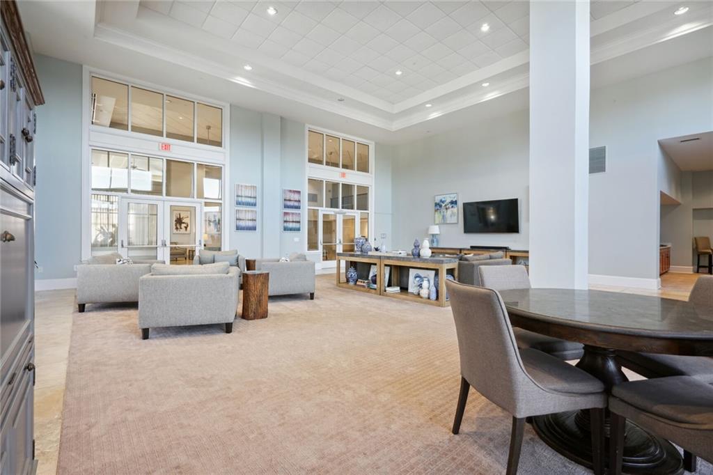 3820 Roswell Road Northeast, Unit 317 Atlanta, GA 30342 - Photo 24 of 29 a living room with furniture and flat screen tv