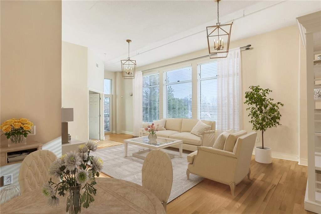 3820 Roswell Road Northeast, Unit 317 Atlanta, GA 30342 - Photo 3 of 29 a living room with furniture and a large window