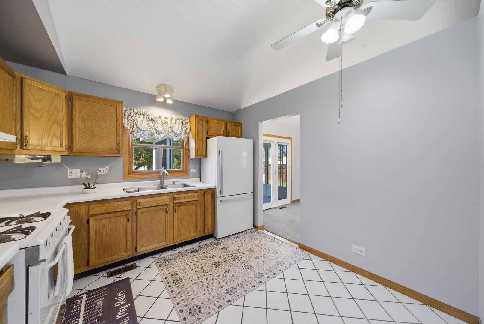 752 Rosanne Street Lockport, IL 60441 - Photo 15 of 32 a kitchen with a sink cabinets and window