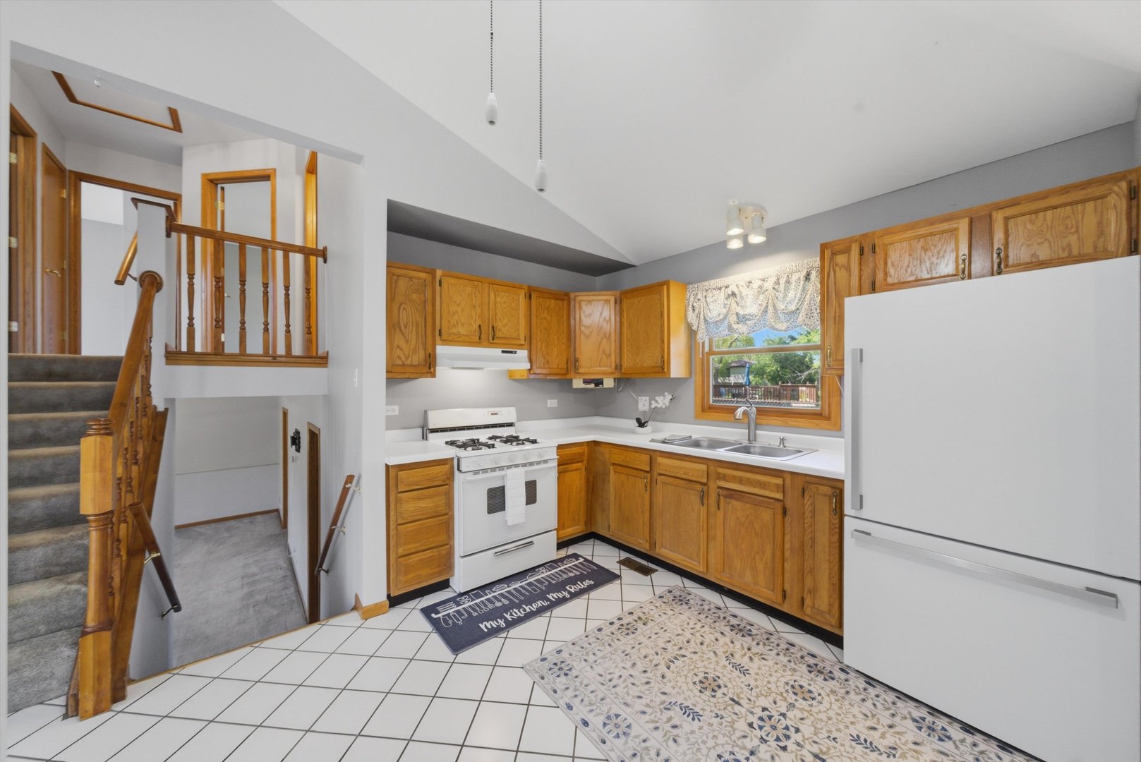 752 Rosanne Street Lockport, IL 60441 - Photo 17 of 32 a kitchen with stainless steel appliances granite countertop a refrigerator a sink dishwasher a stove with white cabinets and wooden floor