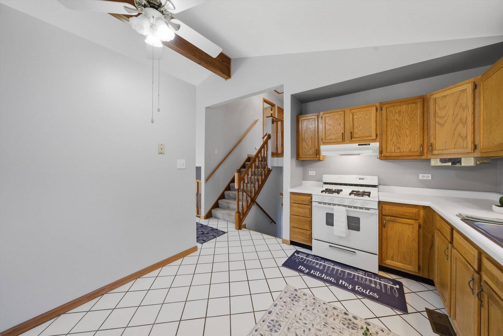 752 Rosanne Street Lockport, IL 60441 - Photo 18 of 32 a kitchen with a stove a sink and a refrigerator