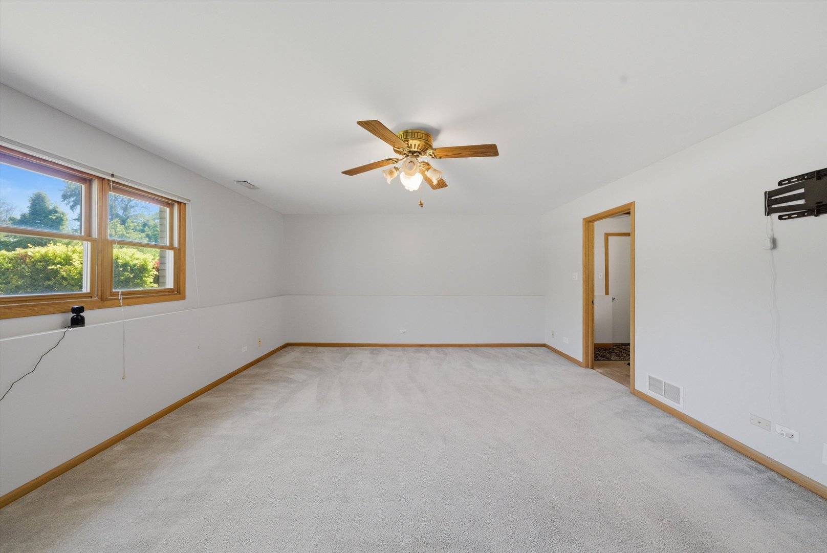 752 Rosanne Street Lockport, IL 60441 - Photo 20 of 32 an empty room with a window and a ceiling fan