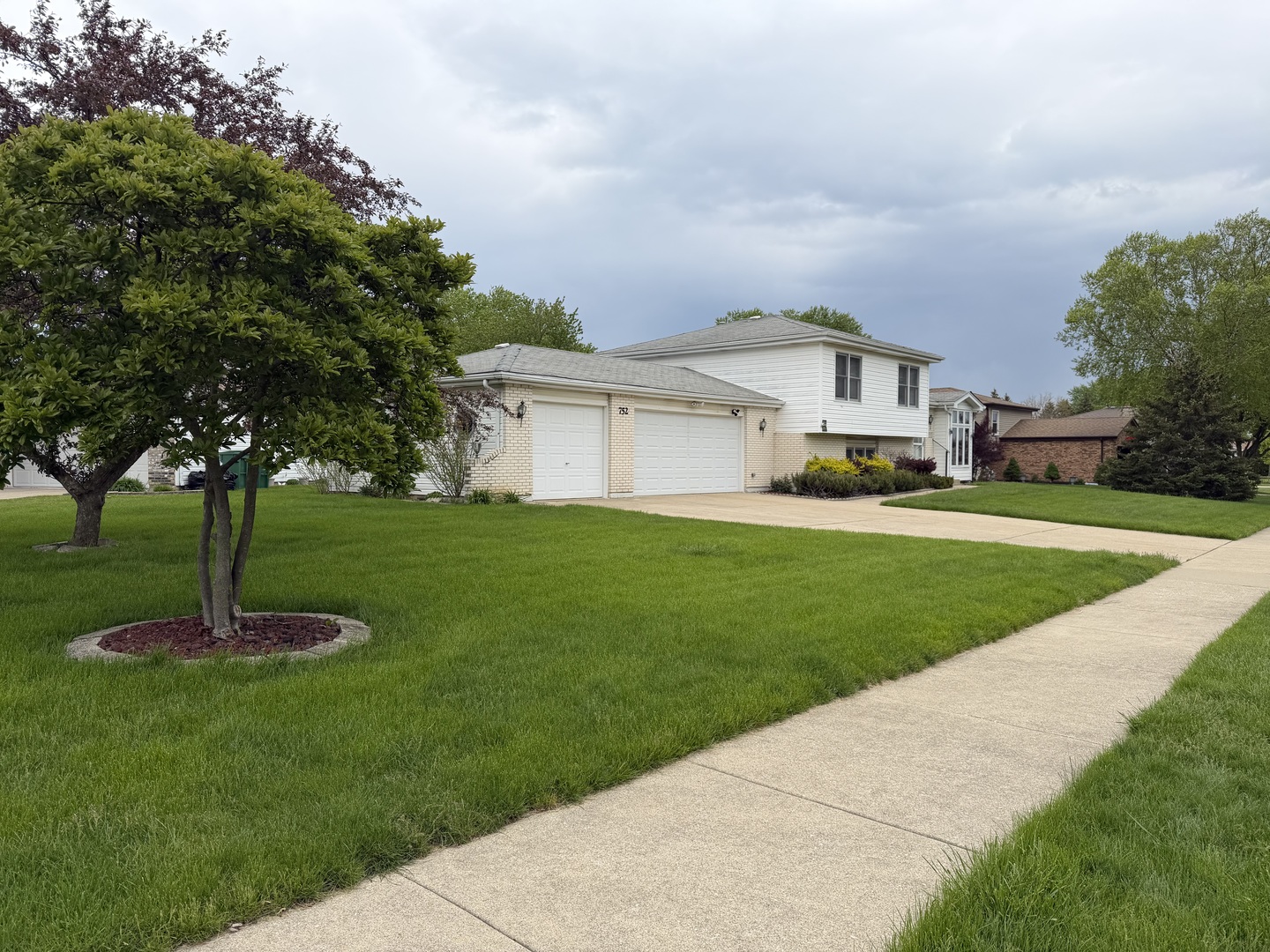 752 Rosanne Street Lockport, IL 60441 - Photo 2 of 32 a front view of a house with a yard garden and trees