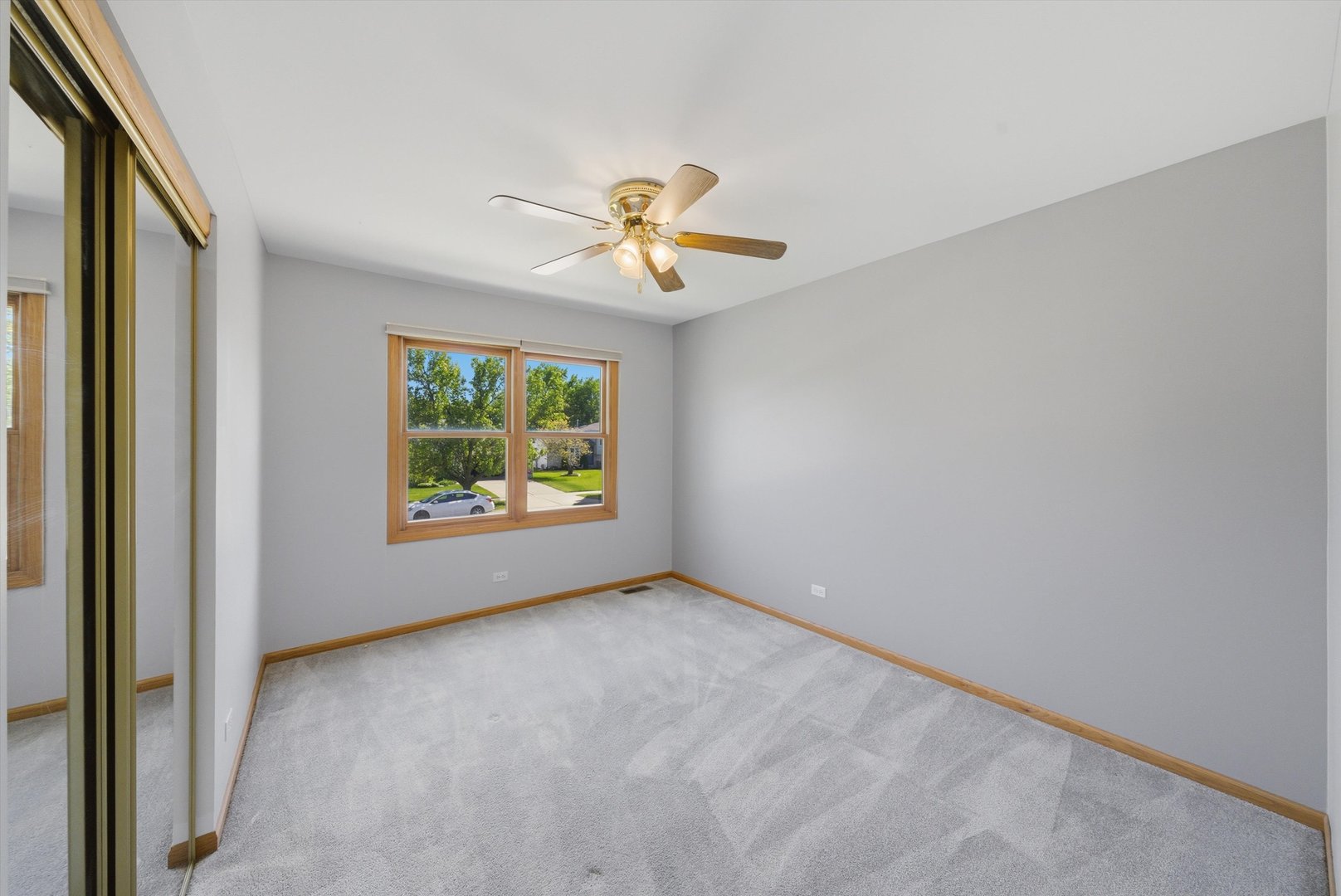 752 Rosanne Street Lockport, IL 60441 - Photo 22 of 32 a view of room with window and ceiling fan