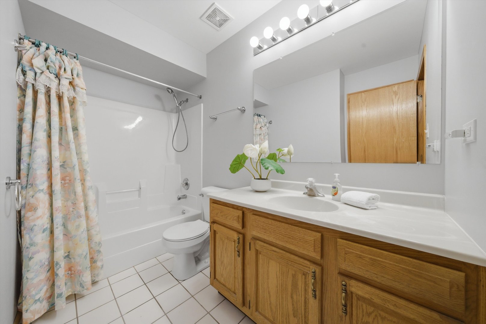 752 Rosanne Street Lockport, IL 60441 - Photo 24 of 32 a spacious bathroom with a granite countertop sink a toilet a shower and a mirror