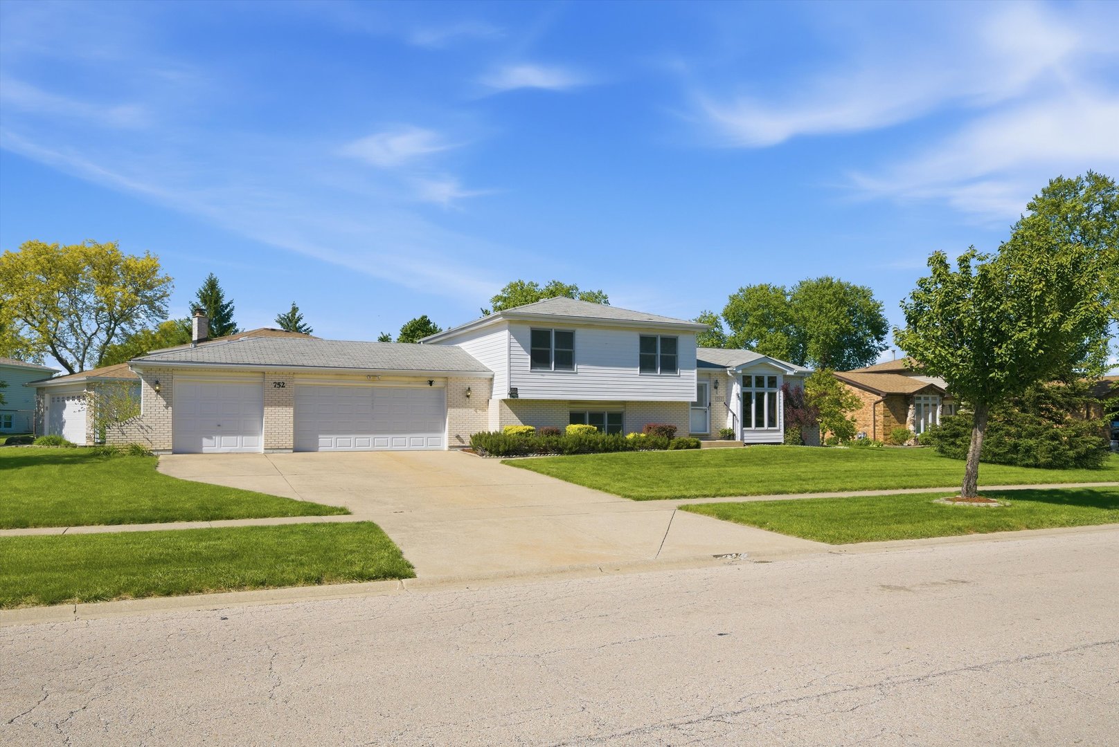 752 Rosanne Street Lockport, IL 60441 - Photo 4 of 32 a front view of a house with a yard and garage