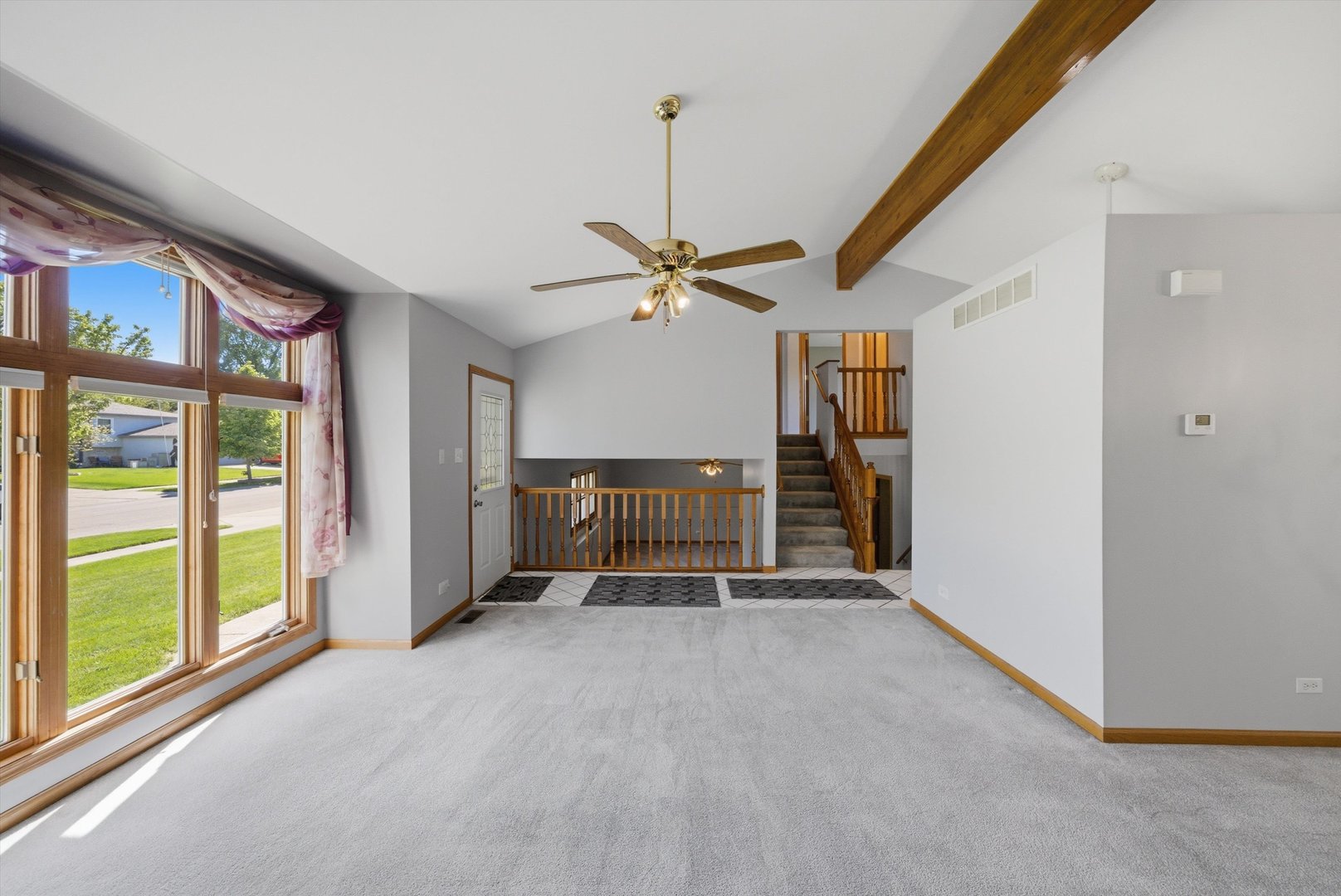 752 Rosanne Street Lockport, IL 60441 - Photo 6 of 32 a view of a livingroom with a ceiling fan and window