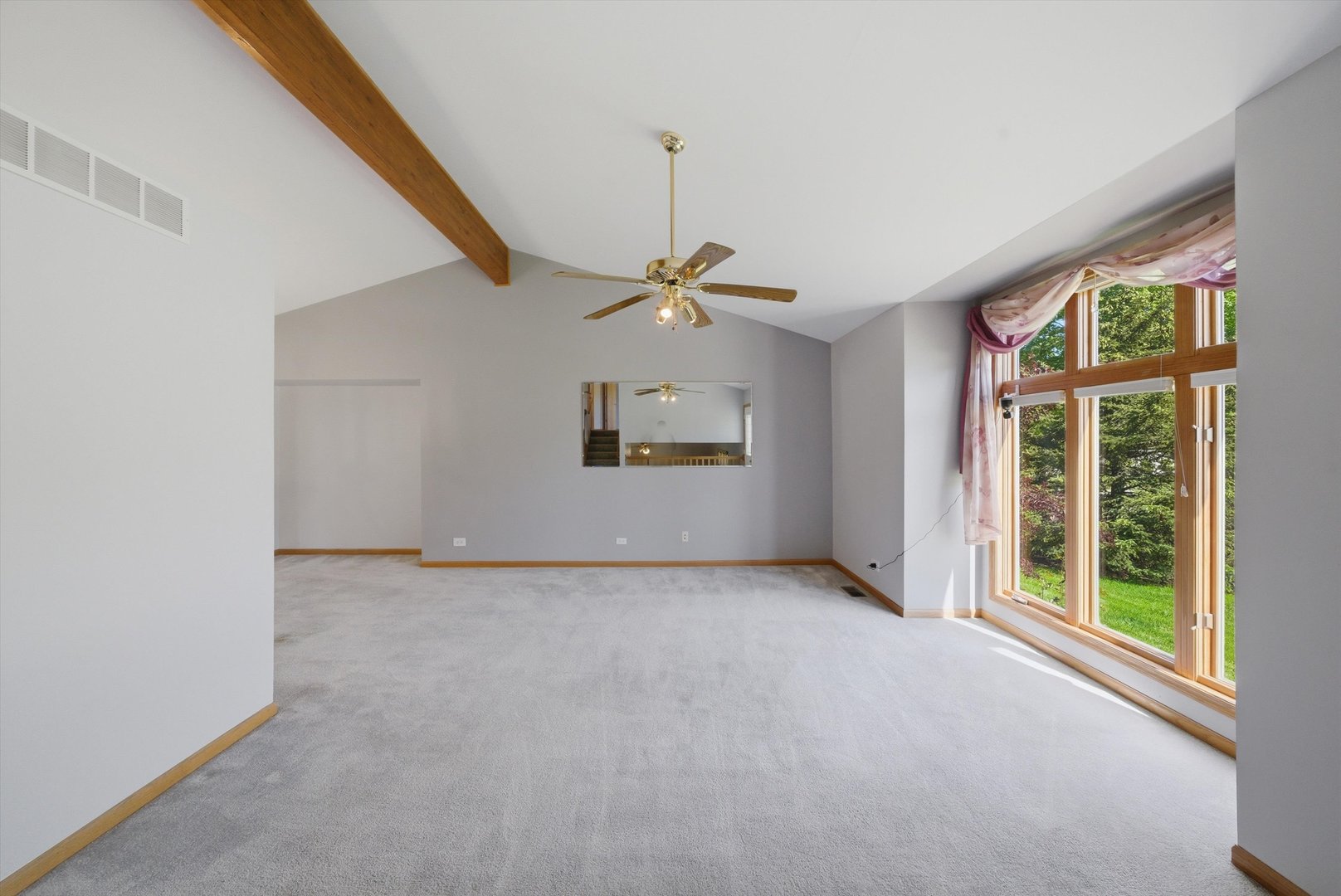 752 Rosanne Street Lockport, IL 60441 - Photo 8 of 32 a view of a livingroom with a ceiling fan and window