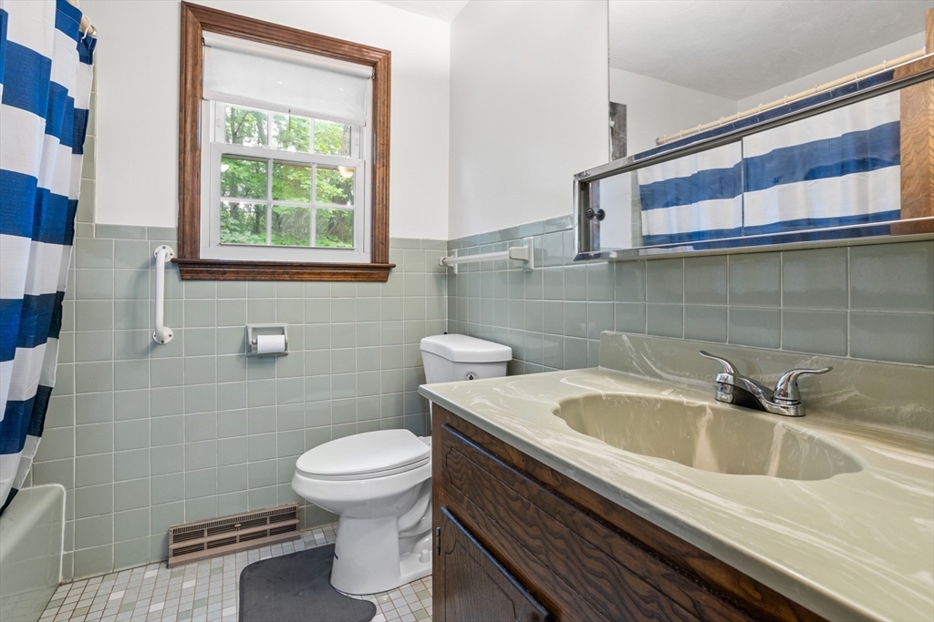 101 Drummer Road, Unit 101 Acton, MA 01720 - Photo 19 of 24 a bathroom with a sink and a toilet