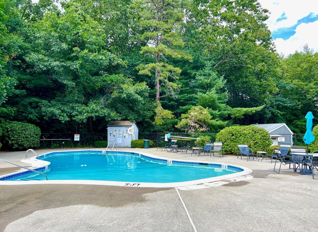 101 Drummer Road, Unit 101 Acton, MA 01720 - Photo 21 of 24 a view of a swimming pool with a patio