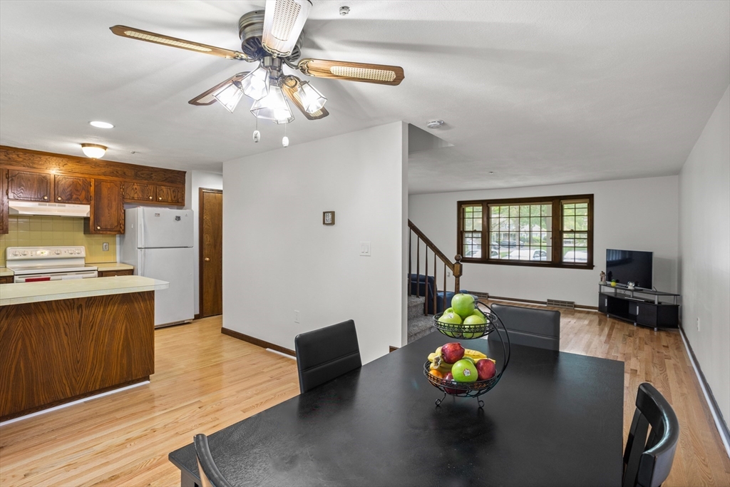 101 Drummer Road, Unit 101 Acton, MA 01720 - Photo 9 of 24 a living room with furniture and a kitchen view